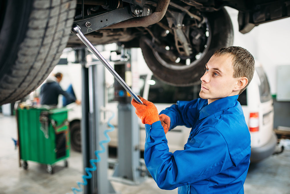 repairman-checks-the-suspension-car-on-t